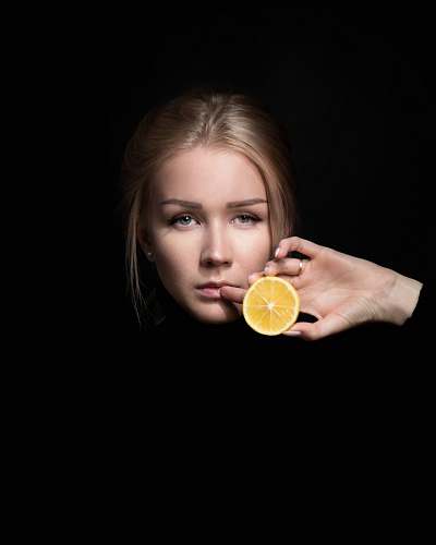 food woman holding slice of orange fruit fruit